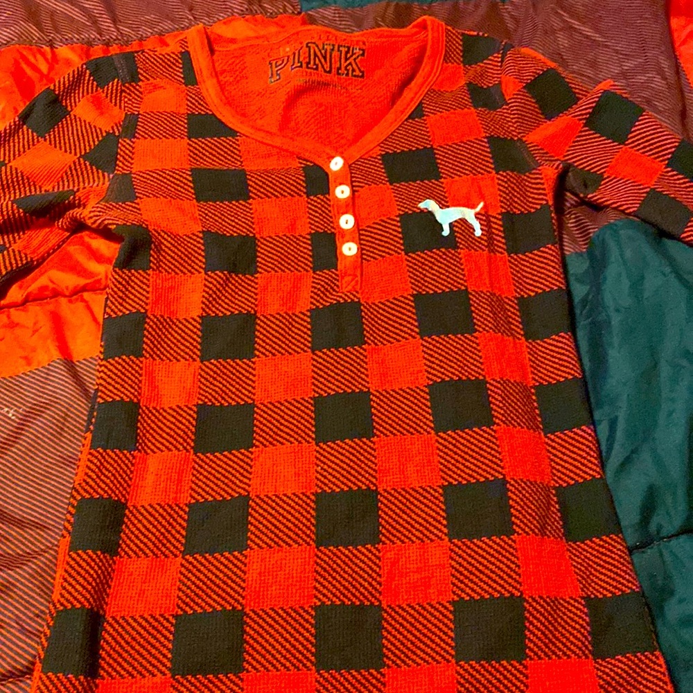 Long sleeve pink shirt. Red and black checkered pattern. Gently used.